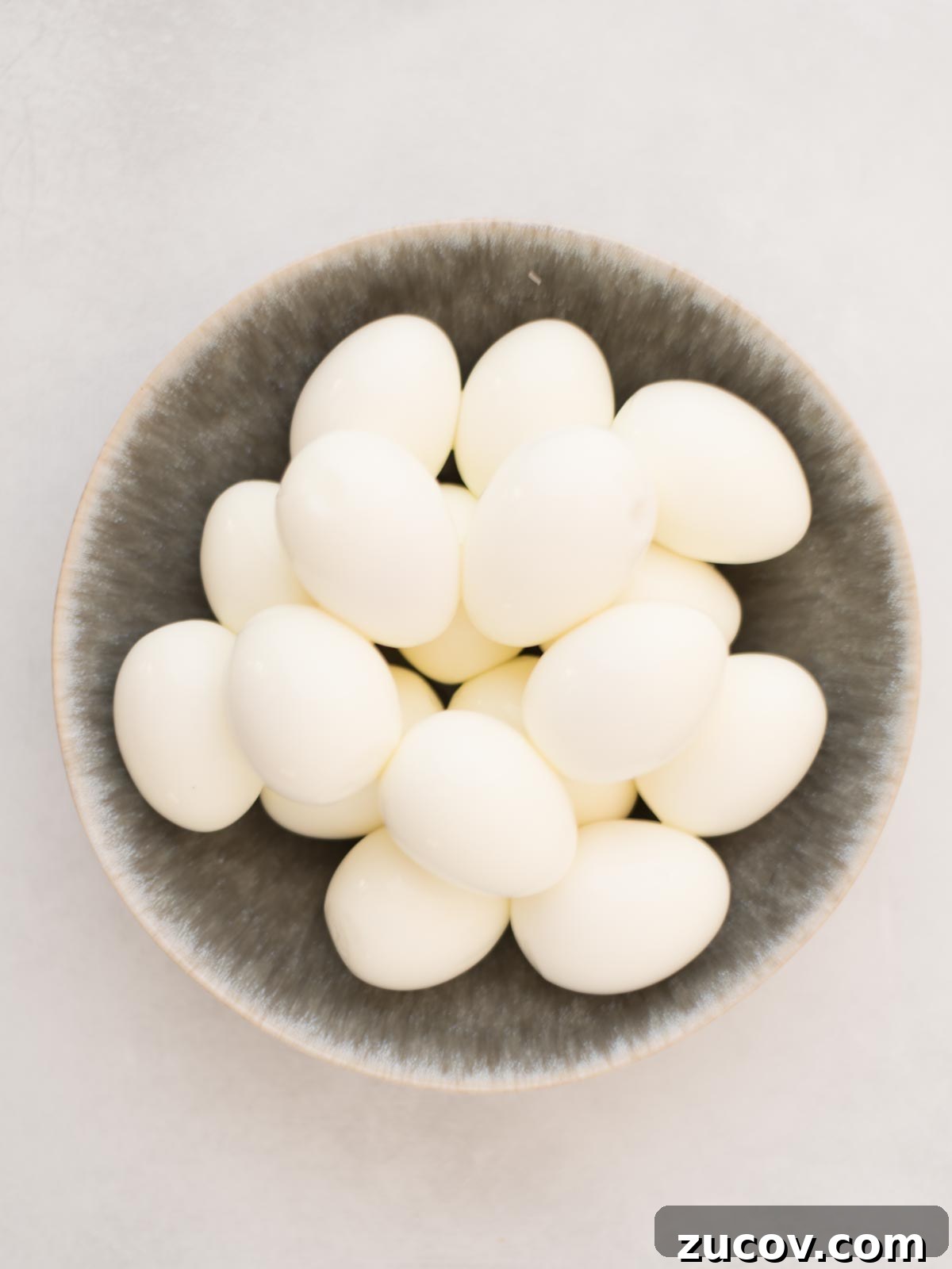 Perfect Hard-Boiled Eggs: Foolproof Method for Firm Whites & Creamy Yolks 5 Hard boiled eggs in a bowl.
