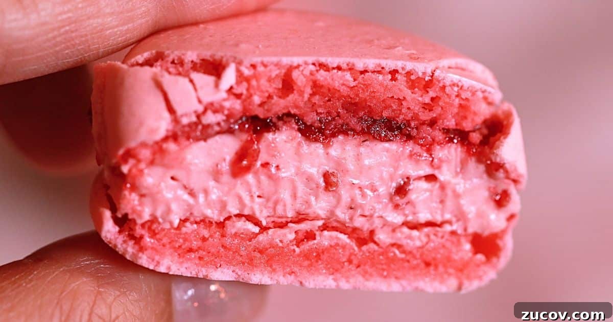 Raspberry Macarons Recipe: Light, Tangy French Cookies 3 the sliced homemade raspberry macaron with raspberry jam and french buttercrem filling
