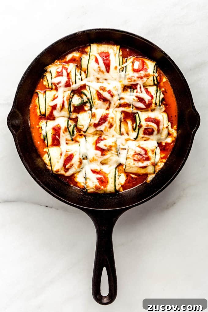 Ricotta-Stuffed Zucchini Roll-Ups with Tomato Basil Sauce 11 Zucchini roll ups in a cast iron skillet