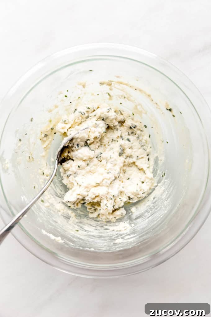 Ricotta-Stuffed Zucchini Roll-Ups with Tomato Basil Sauce 6 Mixed up ricotta and herbs in a mixing bowl