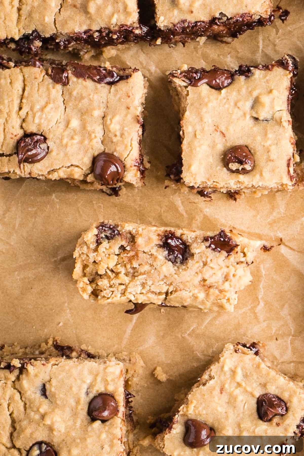 Vegan White Bean Blondies: Chewy, Protein-Packed Treats 3 Squares of chocolate chip blondies, one turned on its side.