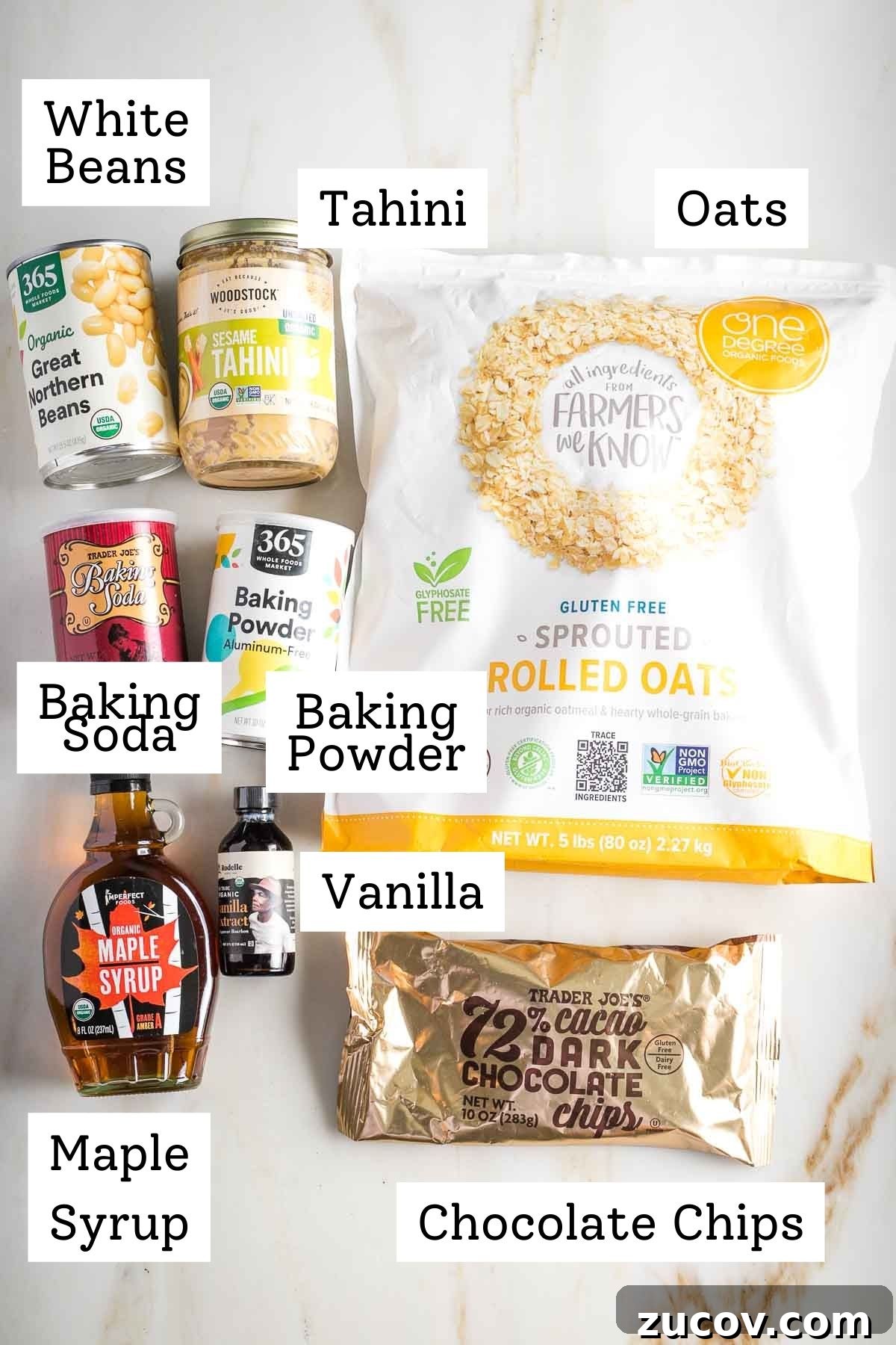 Vegan White Bean Blondies: Chewy, Protein-Packed Treats 4 Labeled ingredients: oats, white beans, tahini, baking powder and soda, maple syrup, vanilla and chocolate chips.