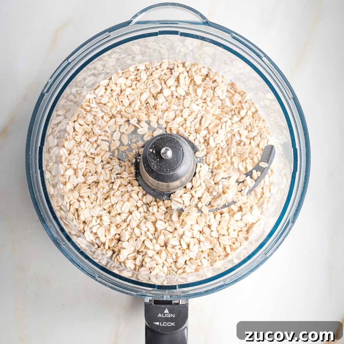 Vegan White Bean Blondies: Chewy, Protein-Packed Treats 5 Rolled oats in the bowl of a food processor.