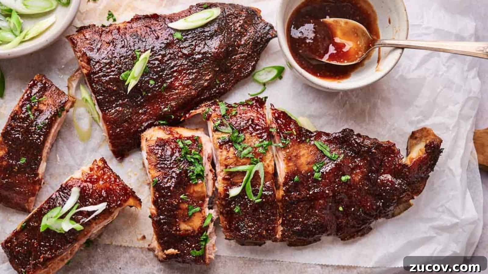 21 Summer Budget Meals That Make Takeout Obsolete 4 Grilled ribs garnished with herbs and served with a side of sauce and onions.