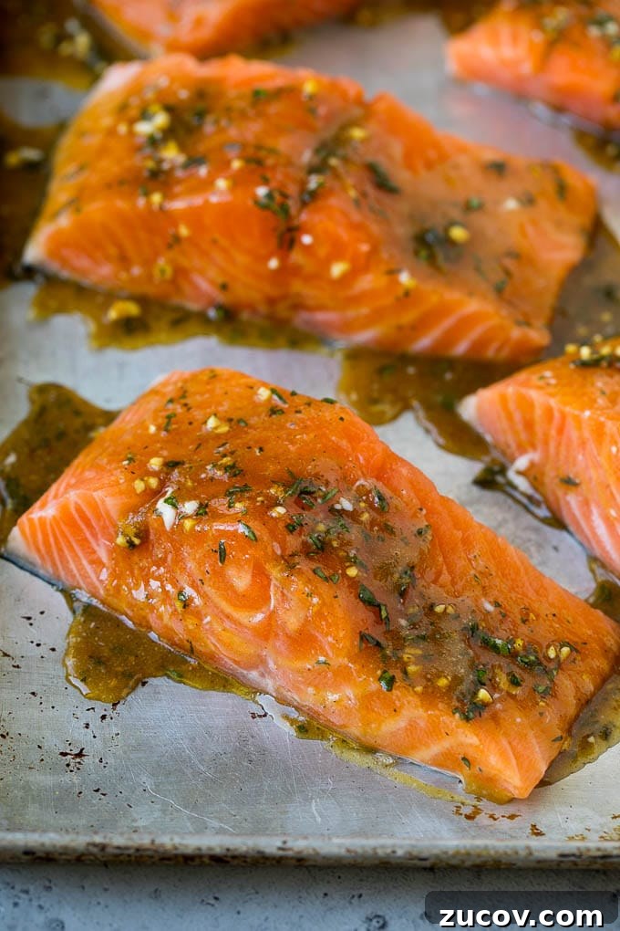 Salmon coated in butter, garlic and herbs Raw salmon coated in a mixture of butter, garlic and herbs.