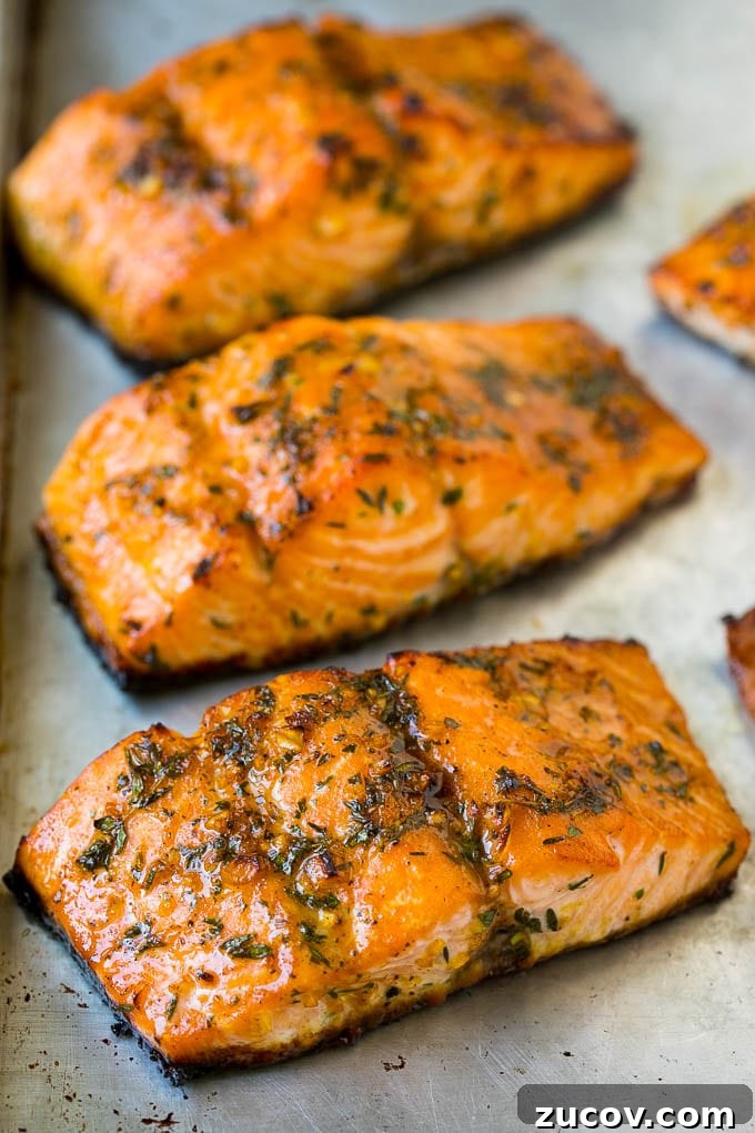 Roasted salmon topped with garlic and herbs Roasted salmon topped with garlic and herbs.
