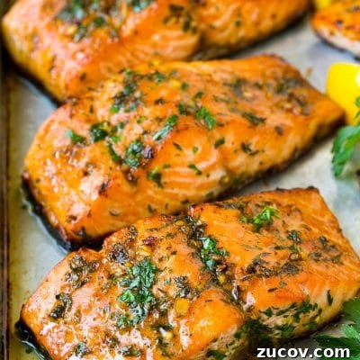 Garlic Butter Baked Salmon with Lemon and Herbs 2 Baked salmon topped with garlic, herbs and butter.