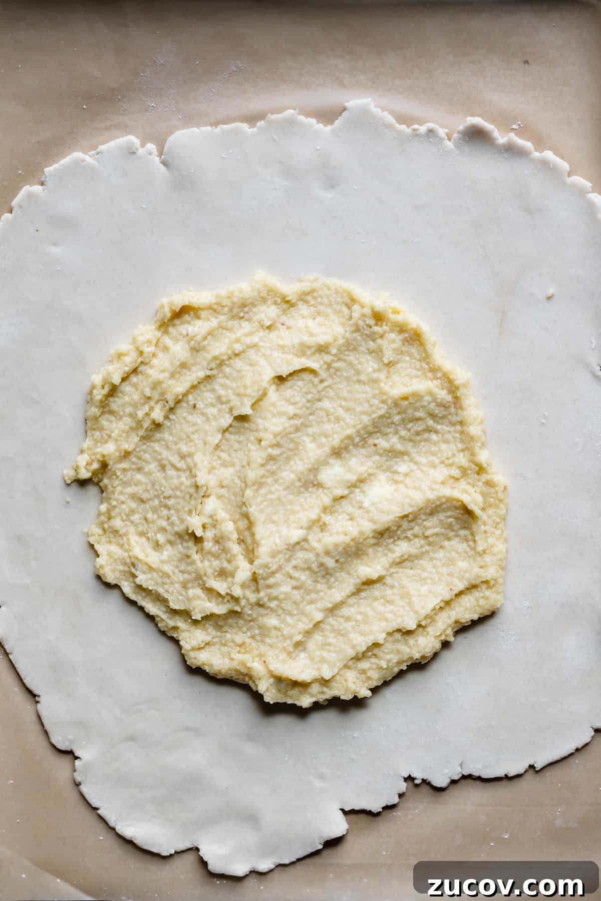Peach and Almond Frangipane Galette Recipe 7 frangipane spread on top of the pie crust