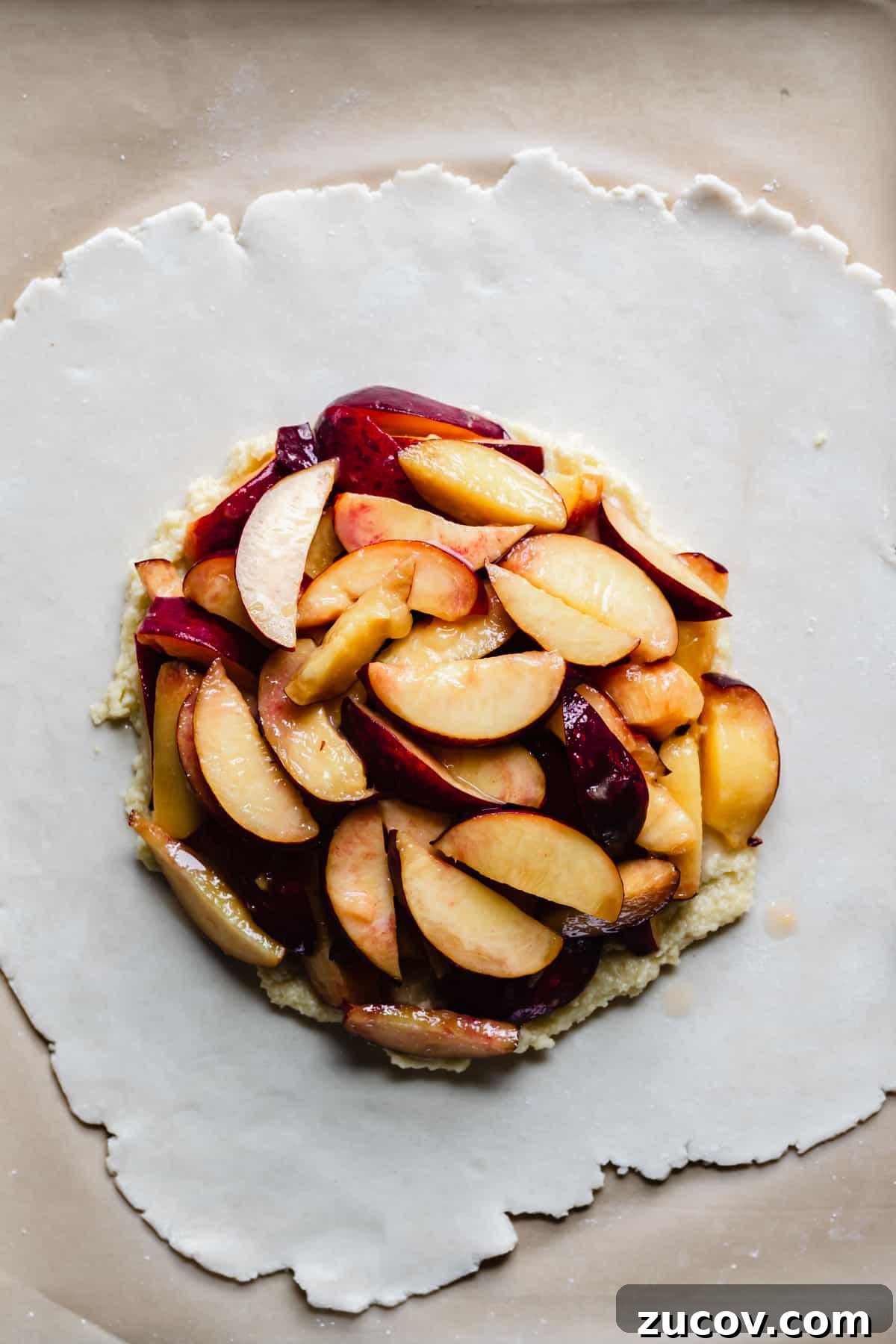 Peach and Almond Frangipane Galette Recipe 8 peaches on top of the frangipane filling and pie crust