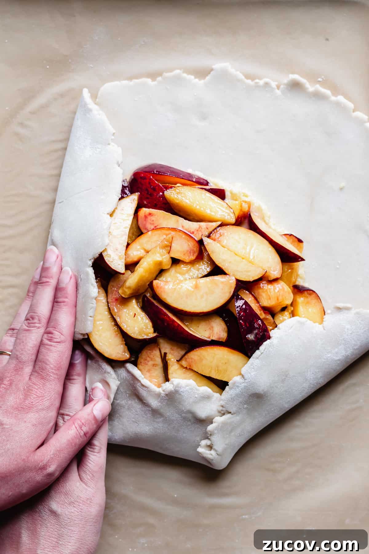 Peach and Almond Frangipane Galette Recipe 9 The galette dough being folded around the peach and frangipane filling