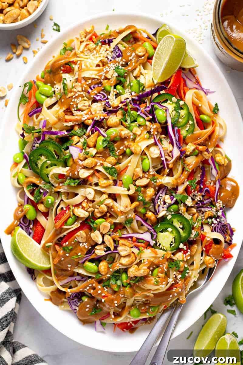 Chilled Vegan Peanut Noodle Salad with Crunchy Veggies 6 Large white platter filled with vegan peanut pasta salad garnished with fresh cilantro
