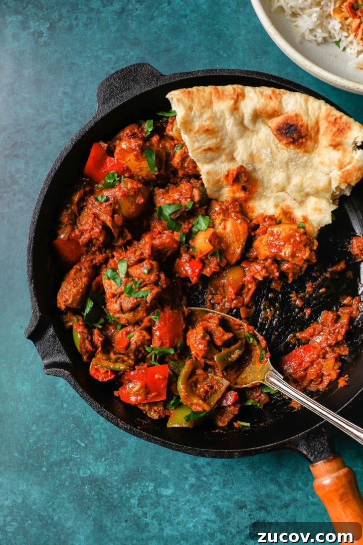Authentic Chicken Jalfrezi Recipe: Spicy Tangy Curry at Home 13 Half-eaten chicken jalfrezi in a black skillet
