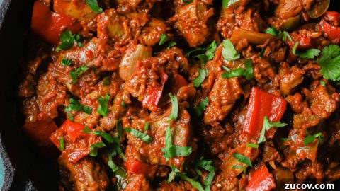 Authentic Chicken Jalfrezi Recipe: Spicy Tangy Curry at Home 20 Cooked Chicken Jalfrezi in a black skillet