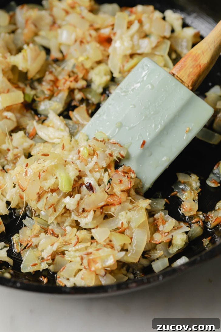 Authentic Chicken Jalfrezi Recipe: Spicy Tangy Curry at Home 6 Adding garlic and ginger to golden onions