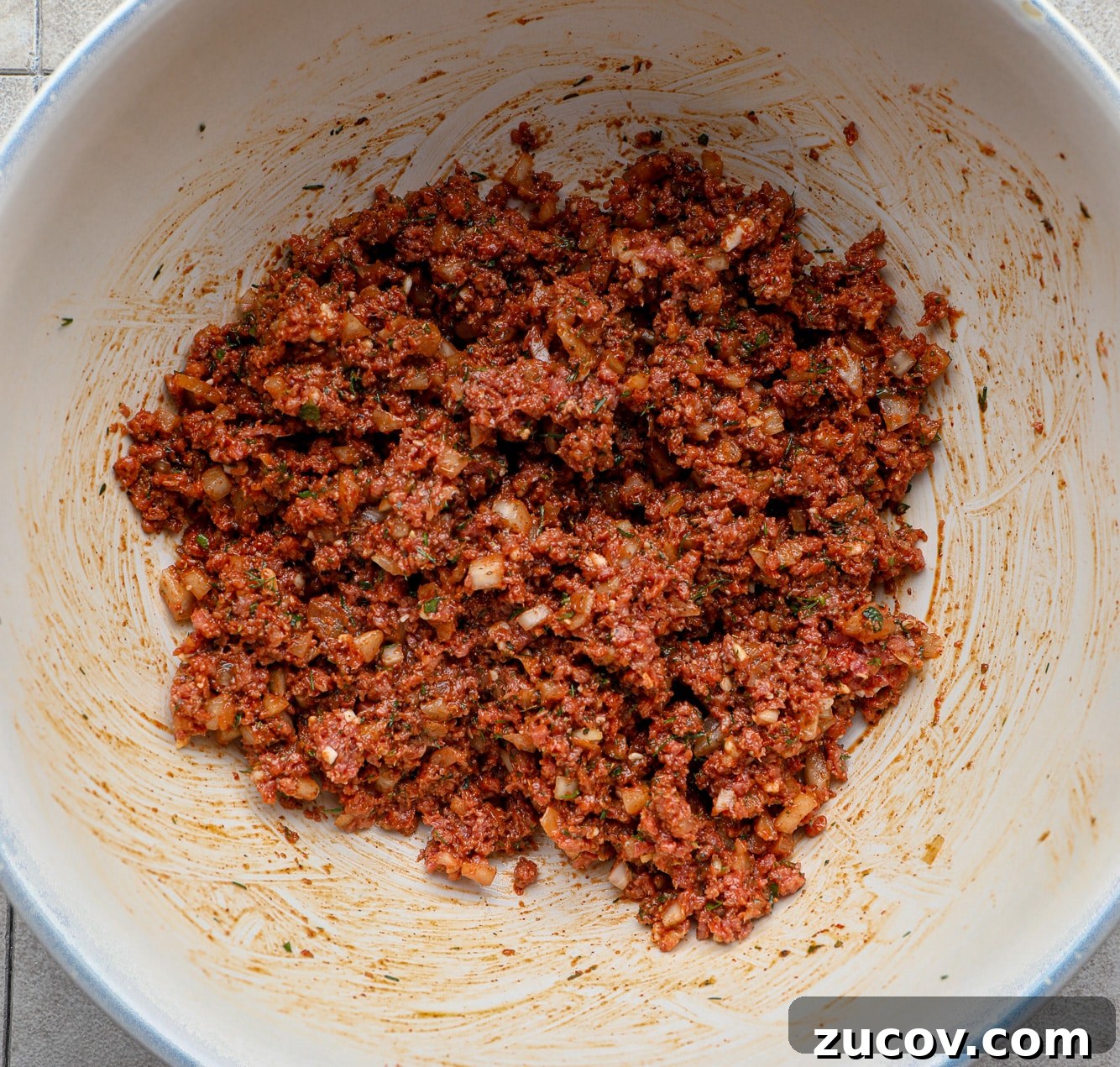 Vegan Kofta Recipe: Flavorful Plant-Based Meatballs 6 a spiced ground vegan meat mixture in a large white bowl.