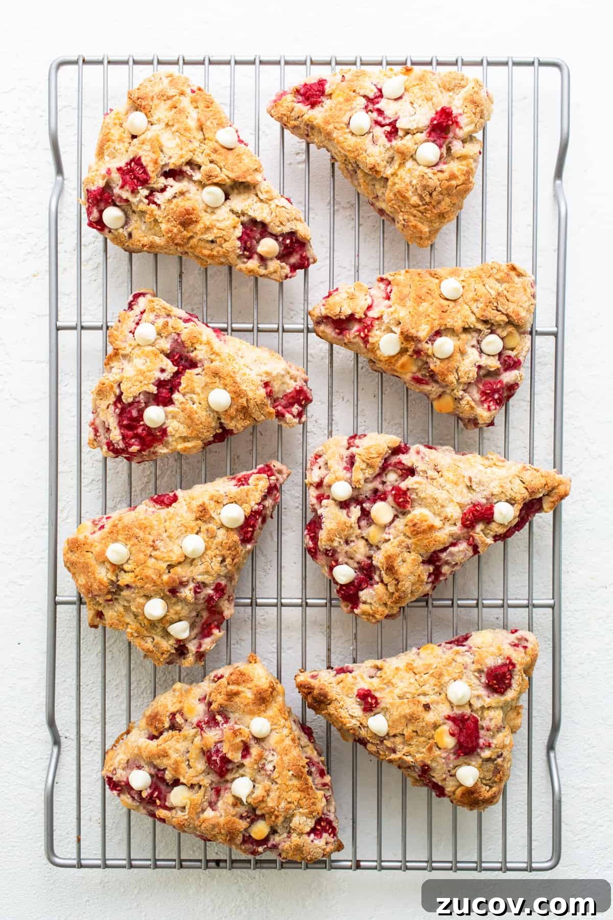 White Chocolate and Raspberry Scones Recipe for Brunch 5 Cranberry scones on a cooling rack.