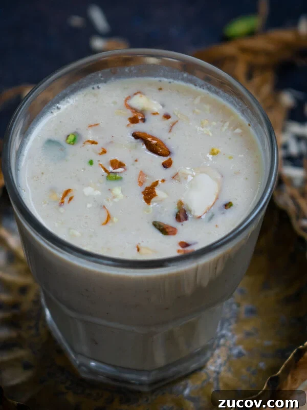 Masala Doodh (Spiced Indian Milk) Recipe — Creamy Cardamom Saffron Milk 12 Turri drink served in a glass.
