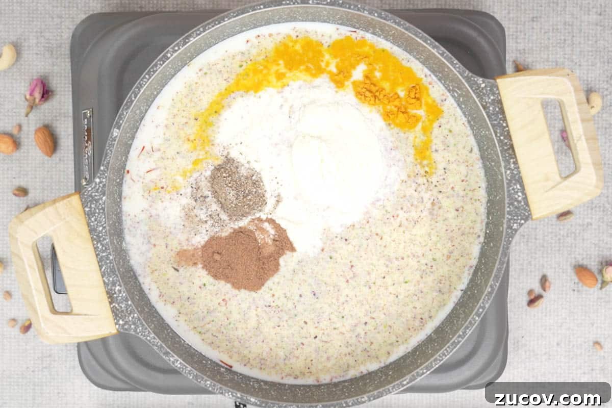 Masala Doodh (Spiced Indian Milk) Recipe — Creamy Cardamom Saffron Milk 6 Nut powder and remaining ingredients added to the pan.