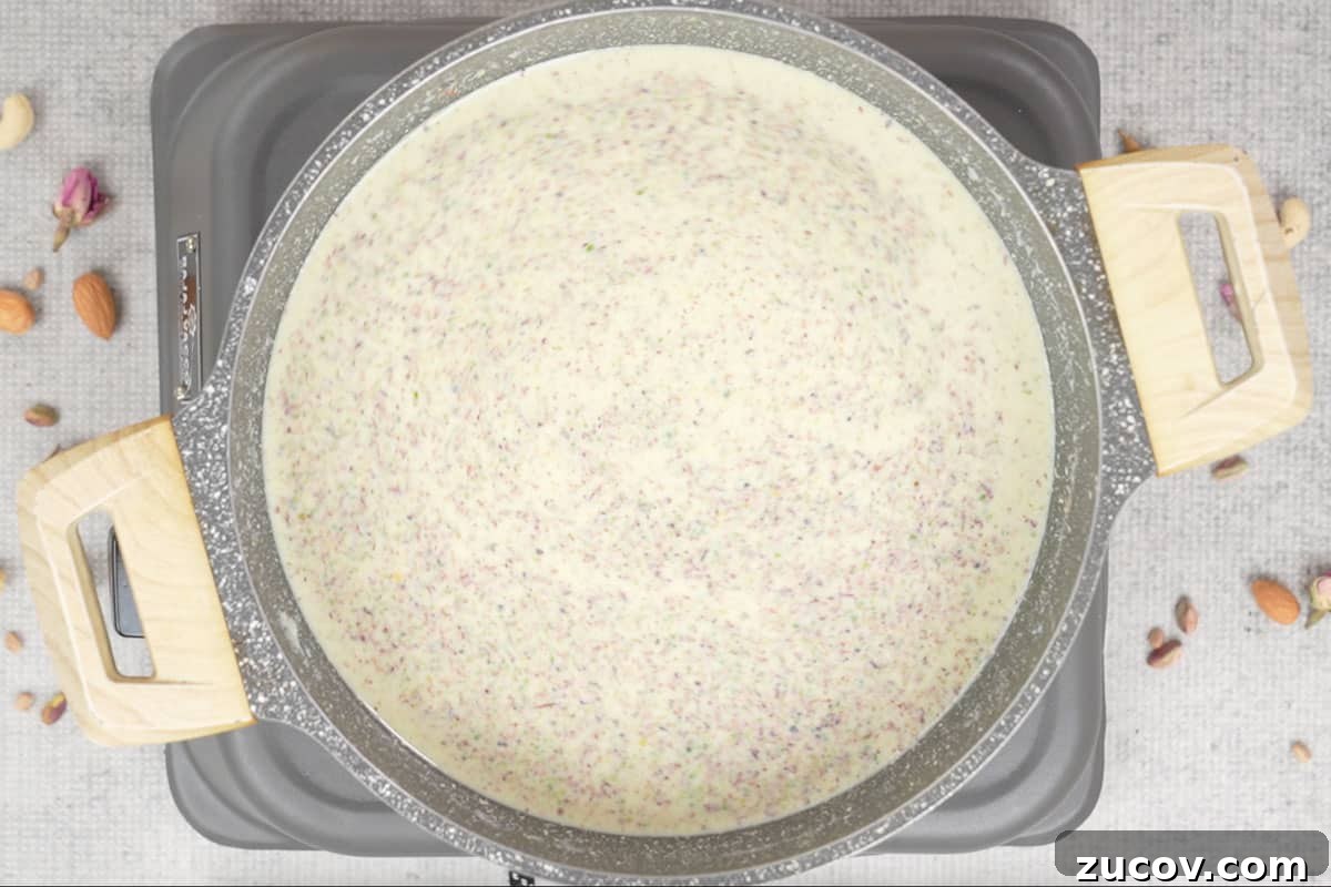 Masala Doodh (Spiced Indian Milk) Recipe — Creamy Cardamom Saffron Milk 7 Mixed well.