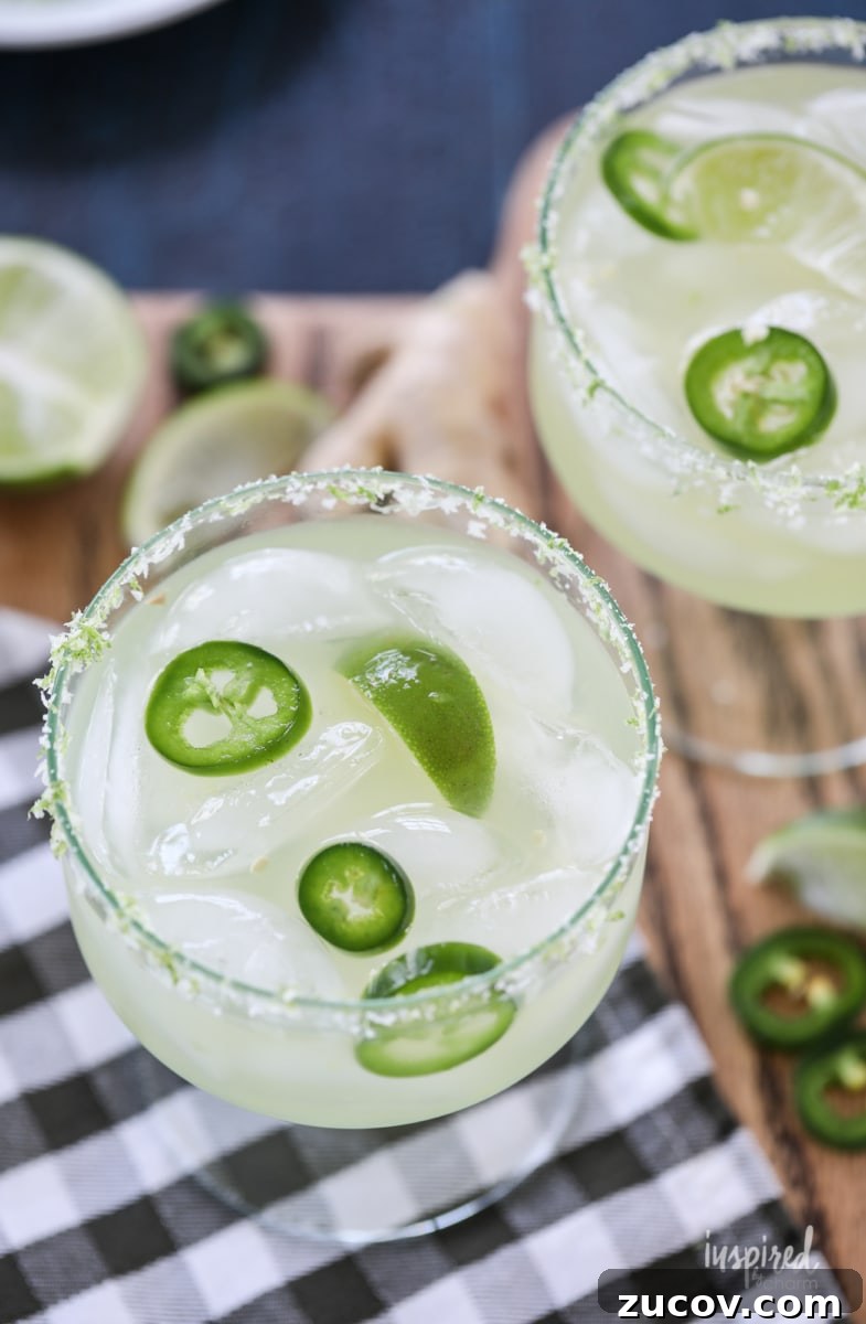 Spicy Jalapeño Margarita Recipe: How to Make It at Home 2 two jalapeño margaritas in glasses.