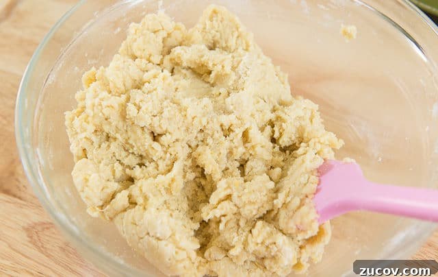 Chewy Lemon Crinkle Cookies Recipe for Bright Citrus Flavor 7 Lemon Crinkle Cookie Dough In DUralex Glass Bowl With Pink GIR Spatula