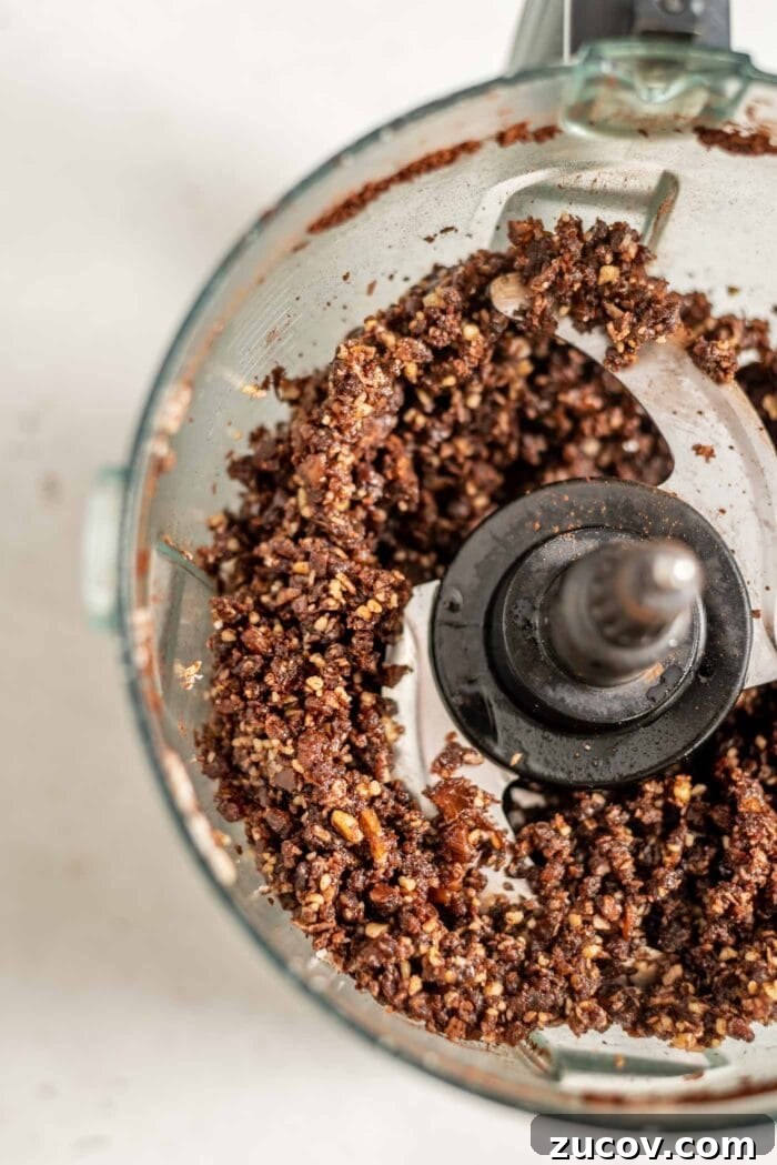 No-Bake Chocolate Caramel Tart Recipe for Quick Desserts 6 Crumbly chocolate dough in a food processor.
