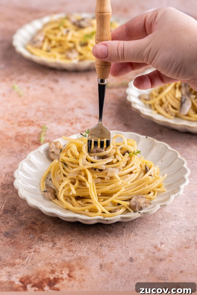 20-Minute Mushroom Marsala Pasta Recipe (Vegetarian) 8 Twirling Pasta with Mushroom Marsala in a fork