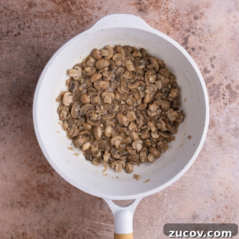 20-Minute Mushroom Marsala Pasta Recipe (Vegetarian) 10 Mushrooms and shallots cooked down in a saucepan