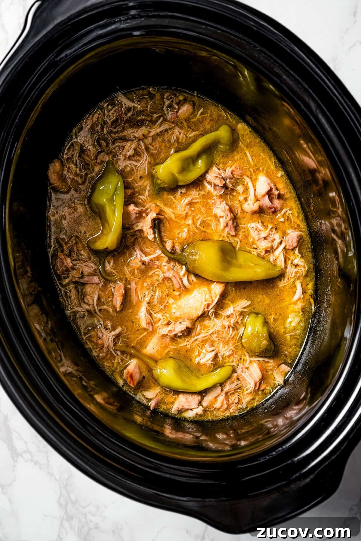 Mississippi Chicken Recipe: Slow Cooker & Oven Methods 8 Overhead view of Mississippi chicken inside the slow cooker.