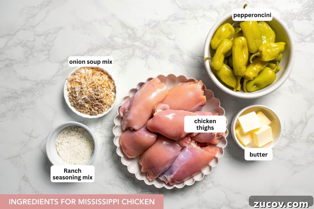 Mississippi chicken is an easy crock pot recipe with juicy chicken shredded in savory pepperoncini ranch sauce. Make it with 5 ingredients! Ingredients for Mississippi chicken with text labels overlaying each ingredient.