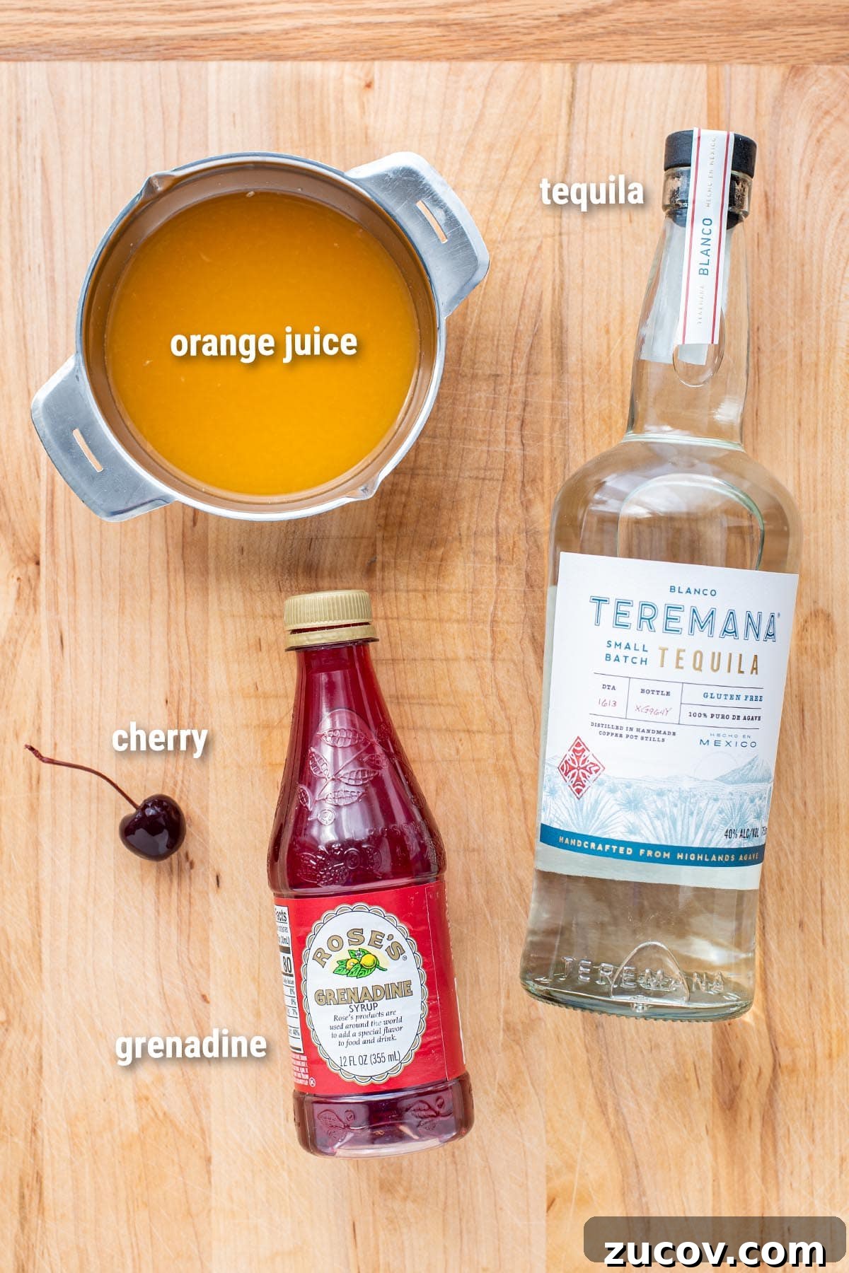 Tequila Sunrise Cocktail Recipe: Ingredients, Tips & Variations 3 Tequila Sunrise cocktail ingredients laid out on a wooden cutting board.