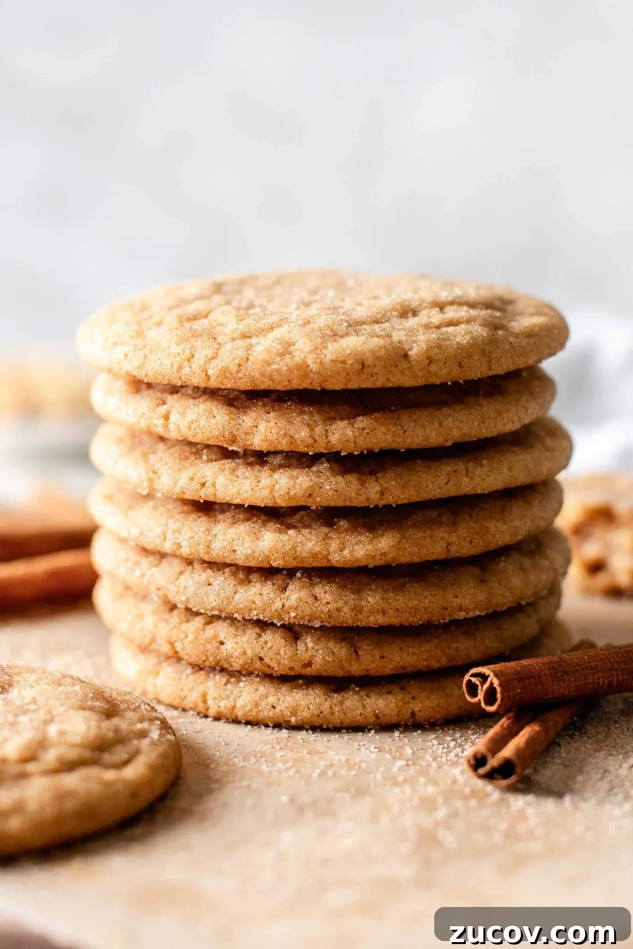 Brown Butter Snickerdoodle Cookies Recipe for Extra-Rich Flavor 8 stacked brown butter snickerdoodle cookies on serving board