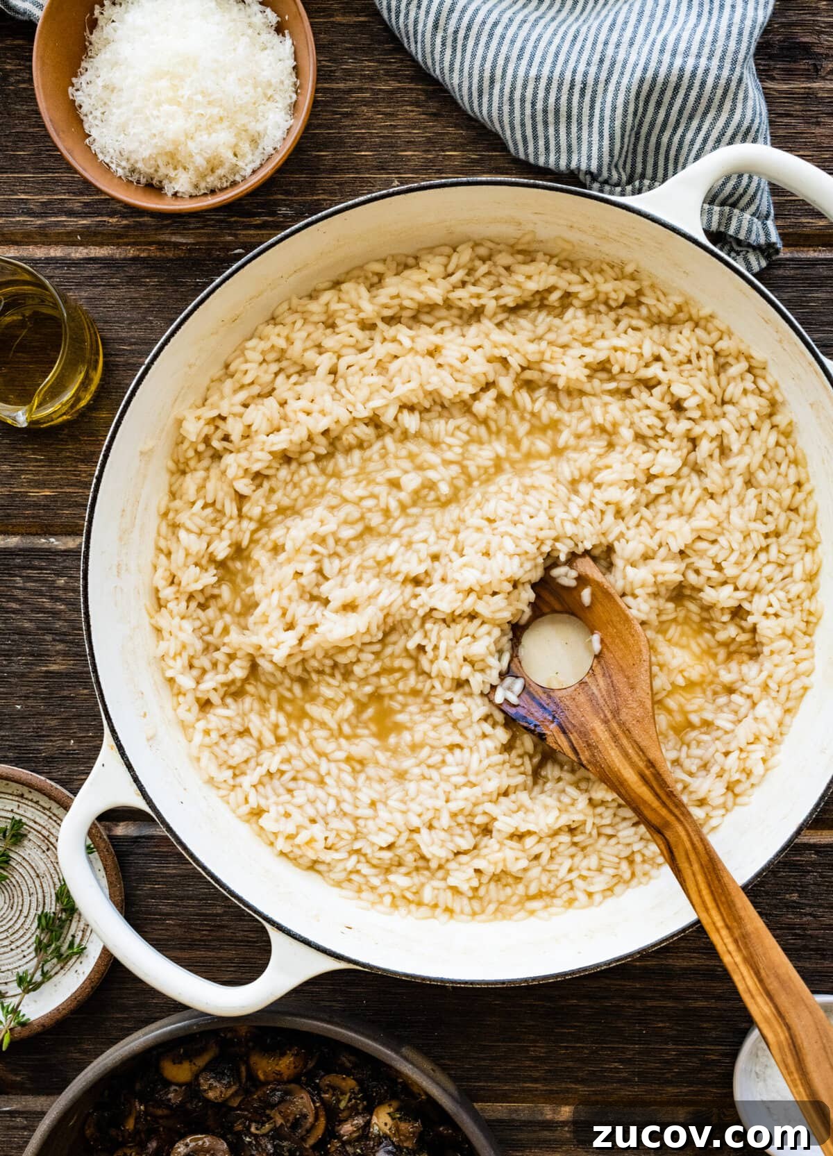 Orzo vs Risotto: Key Differences, Cooking Tips & Recipes 5 How to Make Creamy Mushroom Risotto Instructions- stirring the risotto and stirring.