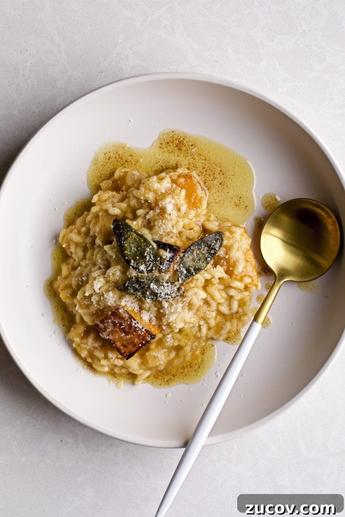 Orzo vs Risotto: Key Differences, Cooking Tips & Recipes 6 Butternut squash risotto in a square serving bowl