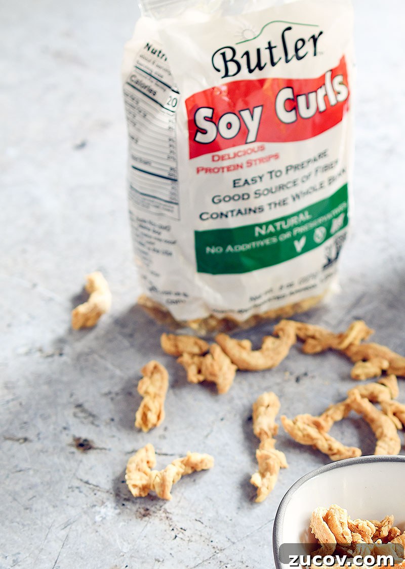 Oil-Free Vegan Butter Chicken with Soy Curls: Creamy Plant-Based Recipe 3 Bag of Butler soy curls with dried soy curls scattered about
