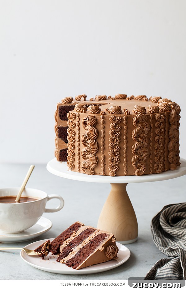 Chocolate Toffee Crunch Cake - fudgy chocolate cake lightly spiced with cinnamon paired with crunchy toffee bits and silky smooth chocolate buttercream frosting | by Tessa Huff
