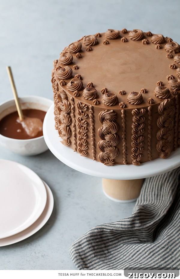 Chocolate Toffee Crunch Cake - fudgy chocolate cake lightly spiced with cinnamon paired with crunchy toffee bits and silky smooth chocolate buttercream frosting | by Tessa Huff