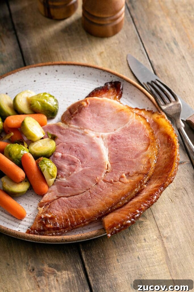 Homemade Honey Baked Ham Recipe (Copycat) 5 Slices of honey baked ham served with roasted veggies.