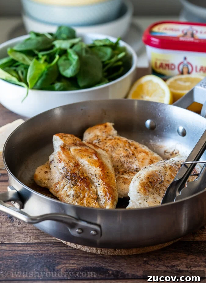 Creamy Garlic Chicken Dinner with Parmesan and Herbs 3 Sear the chicken breast on both sides to create a golden brown crust.