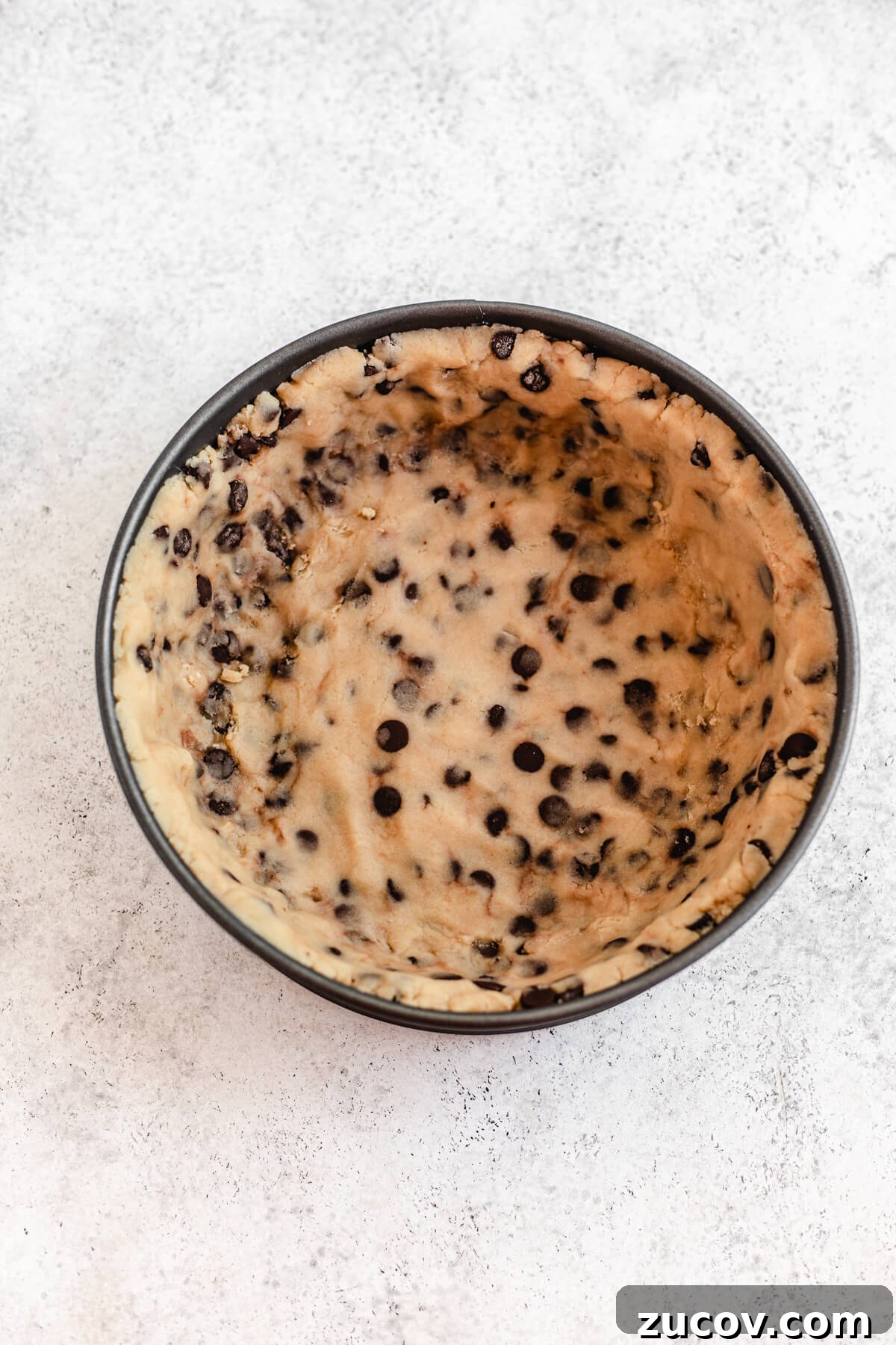 Chocolate Chip Cookie Dough Ice Cream Cake Recipe for Summer Parties 5 cookie dough in the bottom and up the sides of a springform pan
