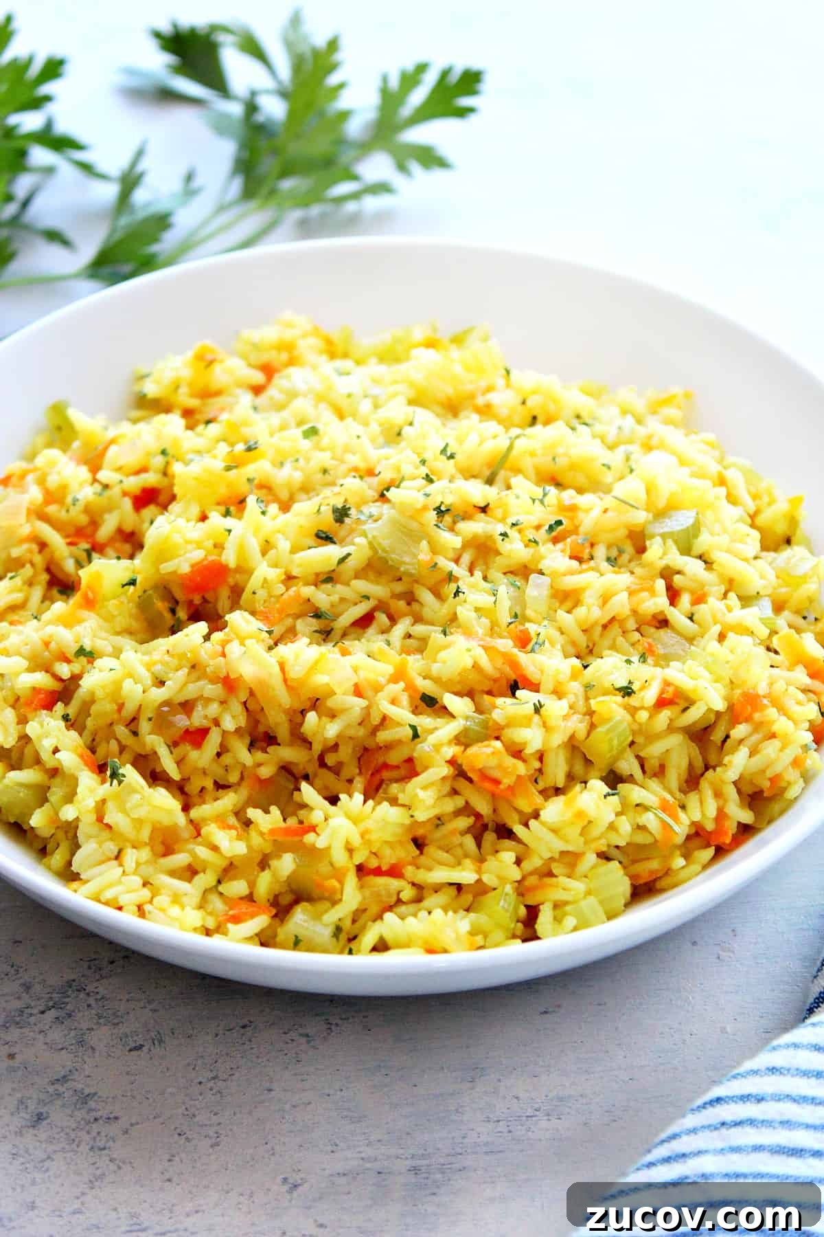 Rice Pilaf Recipe Rice pilaf in a white bowl.