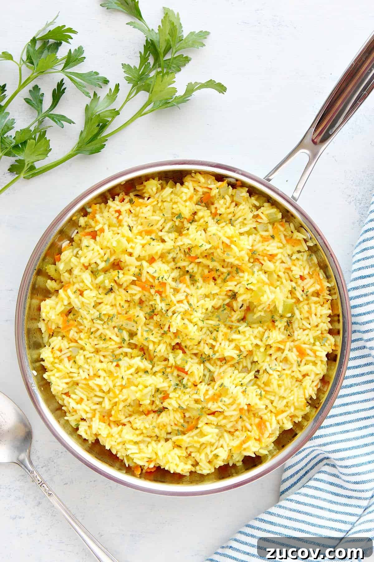 Homemade rice pilaf recipe. Rice dish in a stainless steel pan.