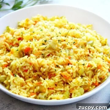 Flavorful Rice Pilaf Recipe: Aromatic, Fluffy, and Simple 3 Rice pilaf in a white bowl.