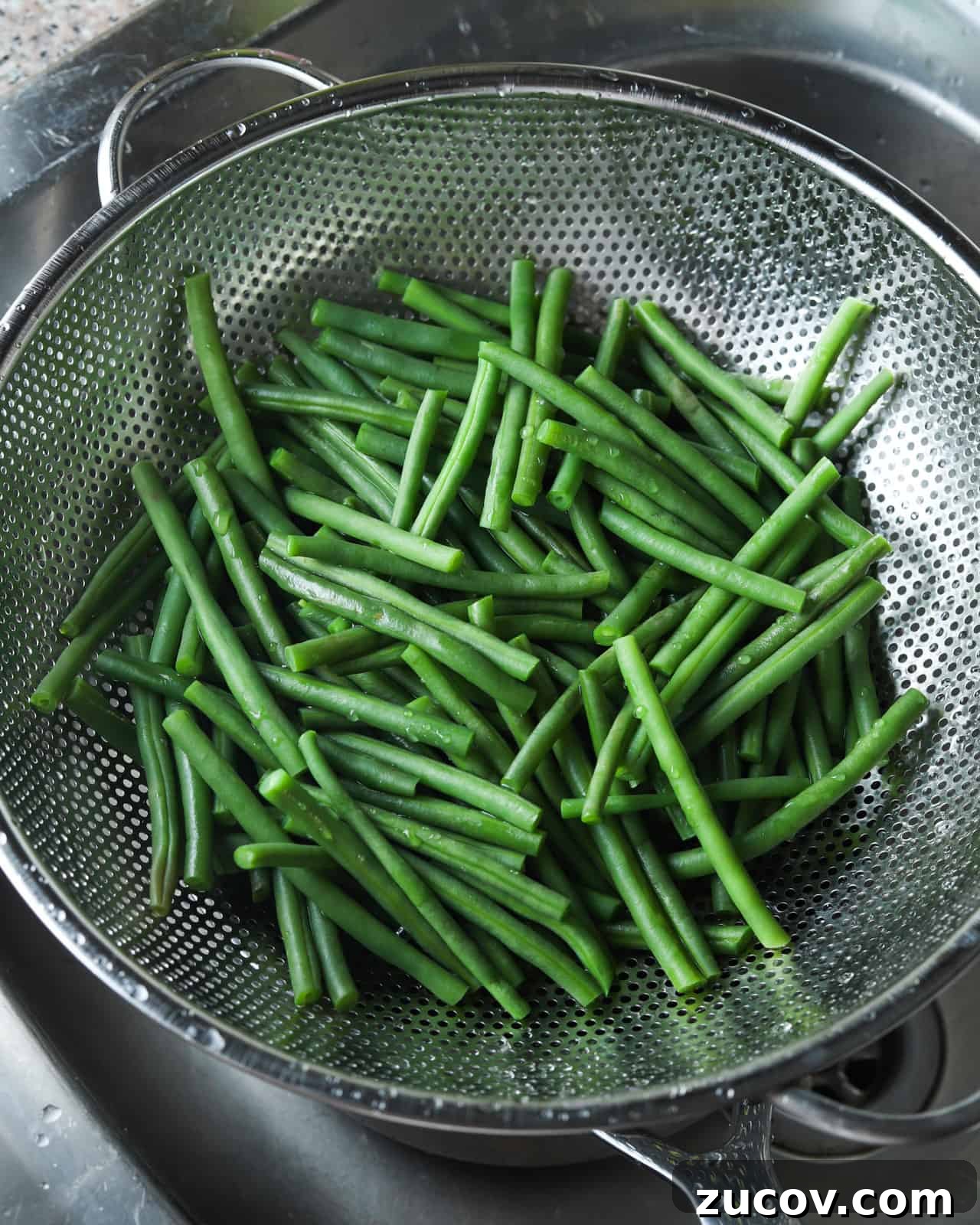 Vegan Green Bean Casserole Recipe with Crispy Onion Topping 6 Draining the green beans after boiling.