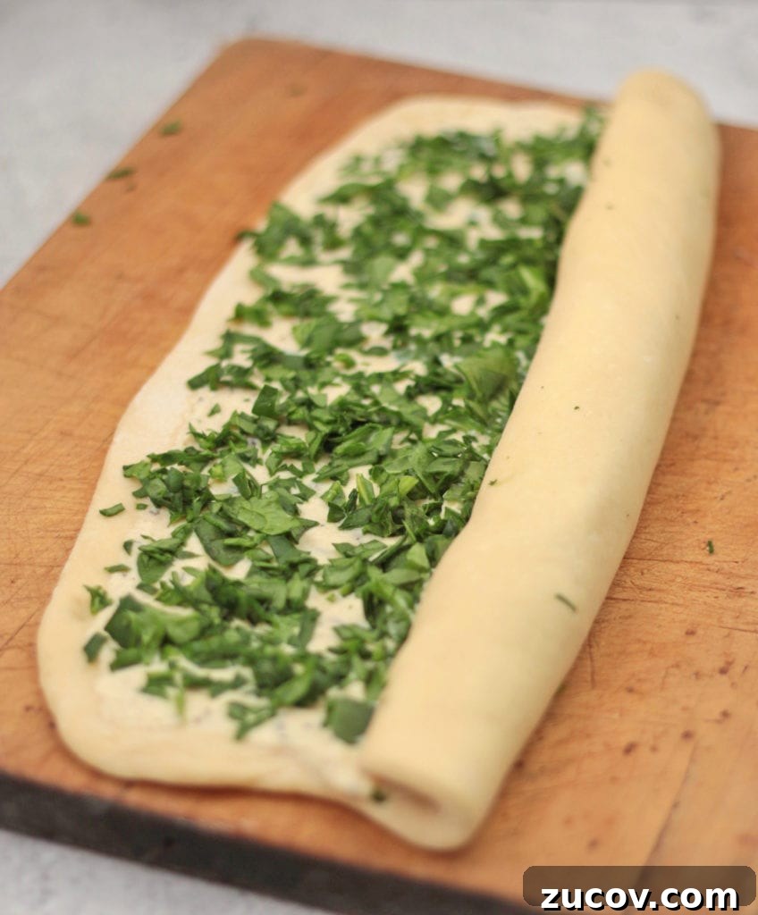 Savory Spinach & Ricotta Stuffed Roll Recipe 6 Roll the bread dough over the filling