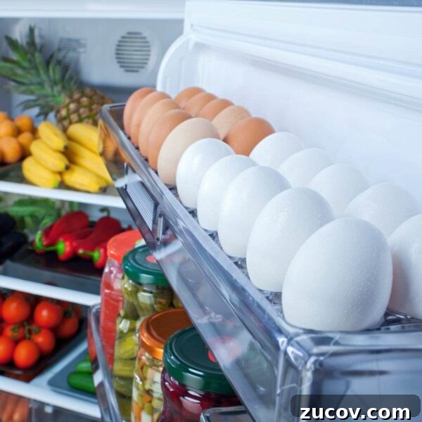 Egg Facts: 10 Frequently Asked Questions About Eggs 5 white and brown eggs in the door of a full refrigerator