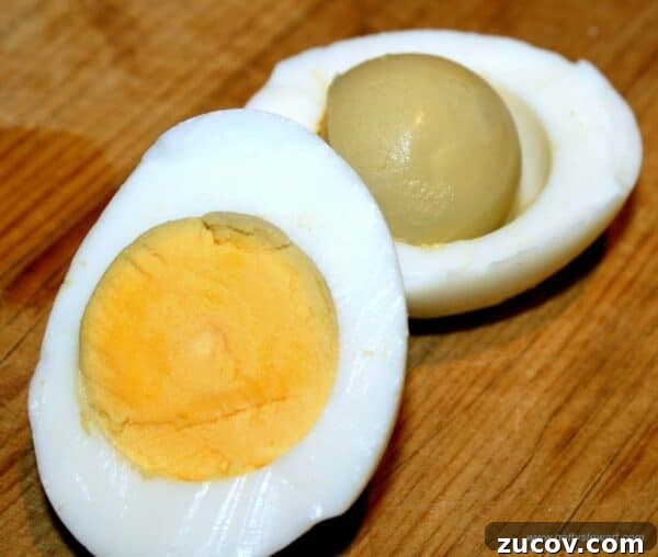 Egg Facts: 10 Frequently Asked Questions About Eggs 9 cooked egg, cut in half with greenish yolk inside