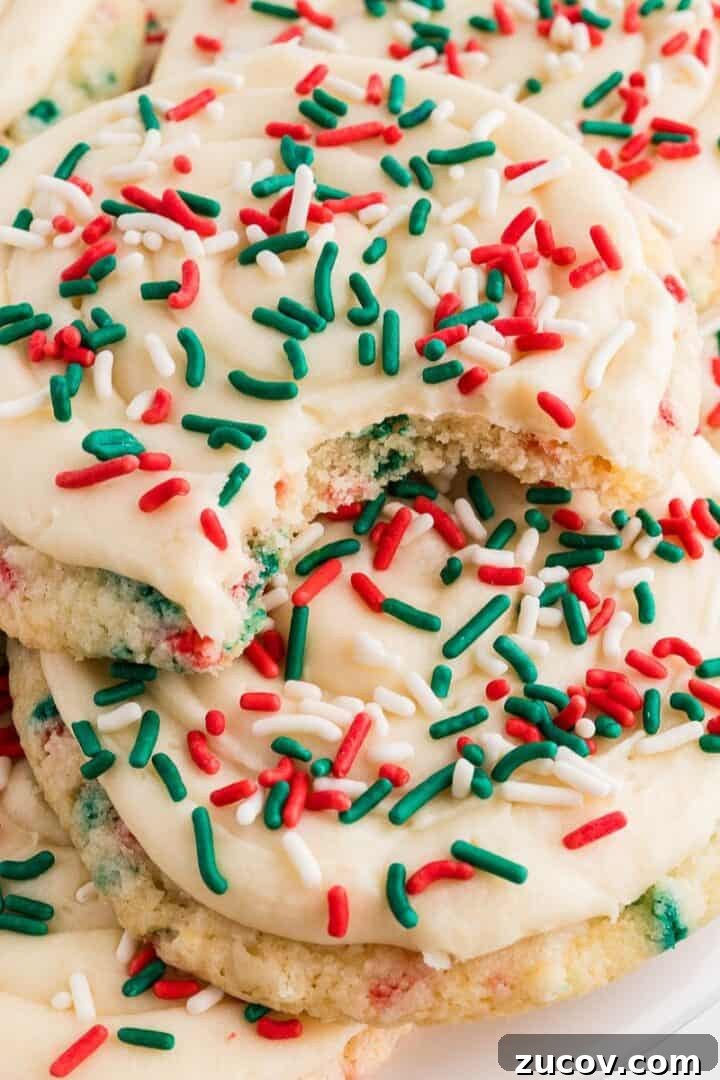 Christmas Crumbl Cookies Gluten Free stacked with sprinkles and bite taken out