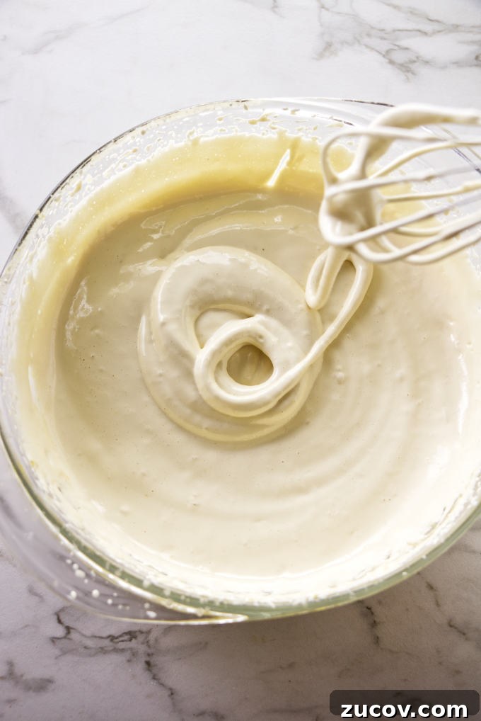 Strawberry Zabaglione Recipe: Light Italian Dessert with Creamy Custard 3 Whipping zabaglione with a whisk.