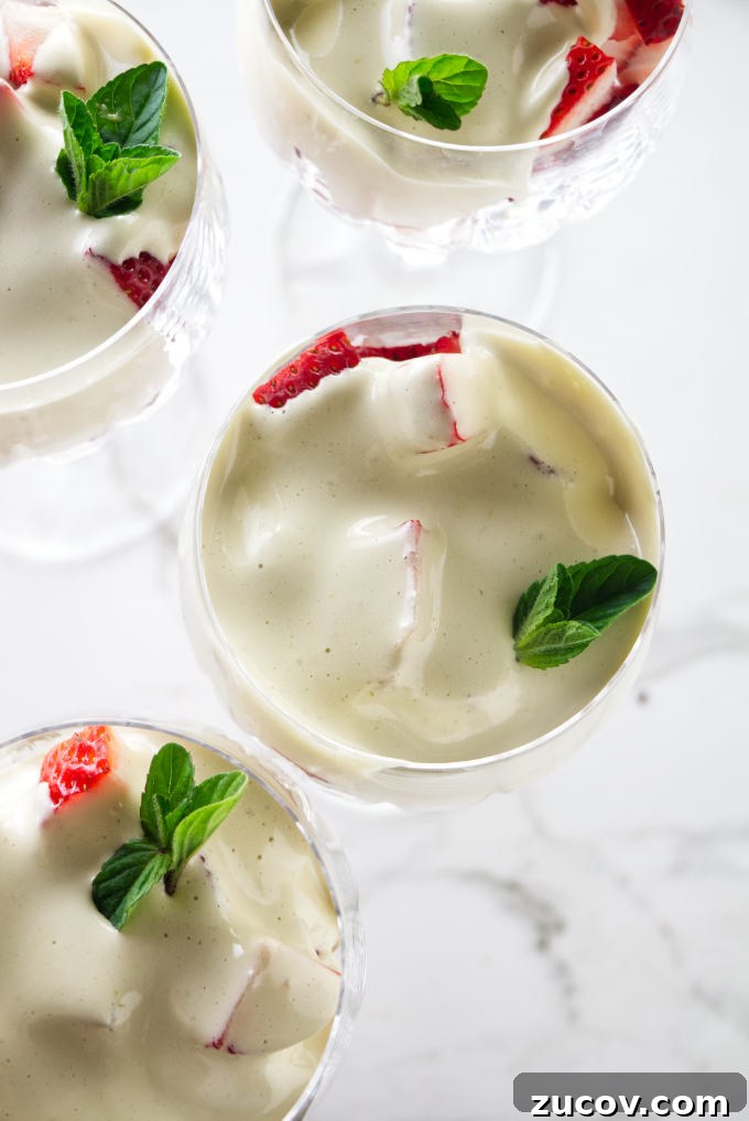Strawberry Zabaglione Recipe: Light Italian Dessert with Creamy Custard 6 Zabaglione drizzled over sliced strawberries.